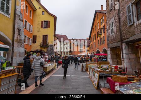 Annecy, France - January 29, 2022: People buying and selling at the old town market of Annecy, France. Stock Photo