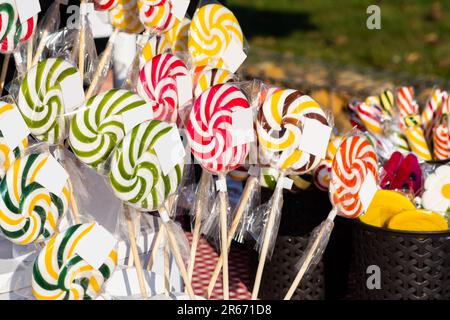 Lollipops delicious wrapped in cellophane. Colorful swirly lollipops Stock Photo