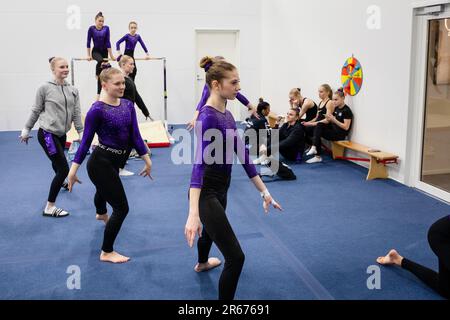 Gymnasts warm up at the Opening of the new Gymnastics Arena in Möckelö on Åland, 3 March 2023. Photograph: Rob Watkins Stock Photo