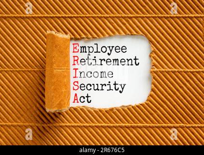 ERISA symbol. Concept words ERISA employee retirement income security act on white paper. Beautiful brown background. Business ERISA employee retireme Stock Photo