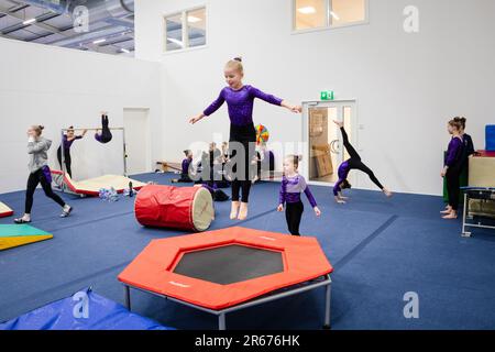 Gymnasts warm up at the Opening of the new Gymnastics Arena in Möckelö on Åland, 3 March 2023. Photograph: Rob Watkins Stock Photo