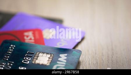 Credit cards on a wooden table. Selective focus, close up, concept. Stock Photo