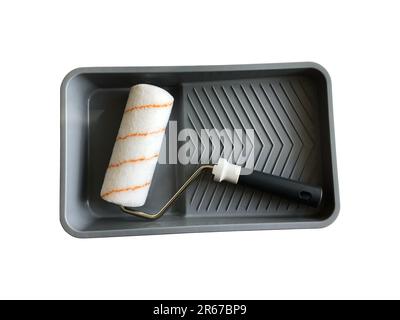 Paint roller in empty tray working tools isolated with clipping path object for making repair works Stock Photo