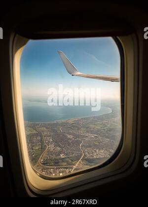 flying on a aeroplane going on vacation Stock Photo