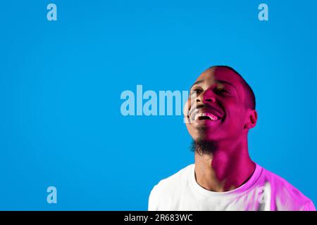 Closeup of thrilled black man looking at free space Stock Photo