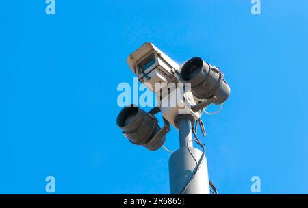 looking up at isolated CCTV security camera with infrared lights, big brother surveillance concept Stock Photo