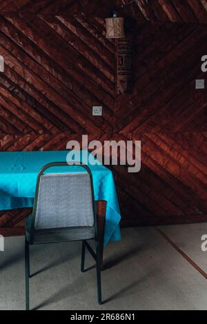 Table and chairs in an outdated conference room with nobody there Stock Photo