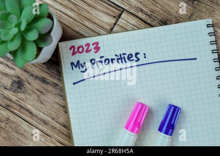 Concept of 2023 My Priorities write on book isolated on Wooden Table. Stock Photo