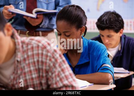High School student being working on an assignment in class Stock Photo