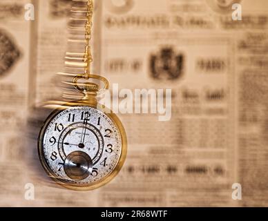 Time flies depicted by a moving pocket watch Stock Photo