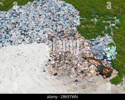 Aerial view waste dump, Waste from household in waste landfill disposal pile plastic garbage and various trash, Environmental pollution . Stock Photo