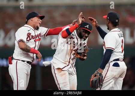 Atlanta Braves' Ozzie Albies (1) gets a hug from Orlando Arcia after hitting  a two-run home run in the fourth inning of a baseball game against the  Cincinnati Reds Tuesday, April 11