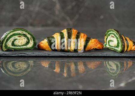 Detailed close-up of crispy, flaky, and delicious bicolour croissant. Stock Photo