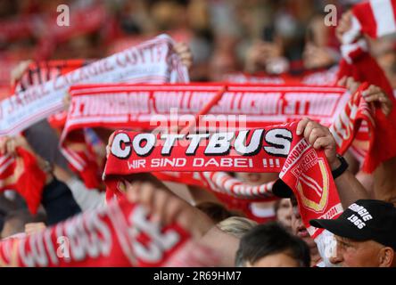 Cottbus, Germany. 07th June, 2023. Soccer: Regionalliga - promotion round to the 3rd league, first leg, FC Energie Cottbus - SpVgg Unterhaching, Stadion der Freundschaft. Cottbus fans hold up scarves. Credit: Robert Michael/dpa/Alamy Live News Stock Photo