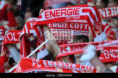 Cottbus, Germany. 07th June, 2023. Soccer: Regionalliga - promotion round to the 3rd league, first leg, FC Energie Cottbus - SpVgg Unterhaching, Stadion der Freundschaft. Cottbus fans hold up scarves. Credit: Robert Michael/dpa/Alamy Live News Stock Photo