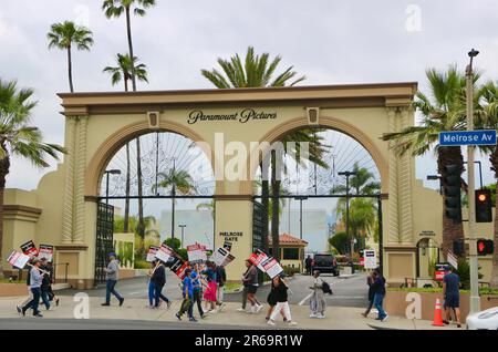 Writers Guild of America screenwriter strikers protesting outside Paramount Pictures studios 5555 Melrose Avenue Hollywood Los Angeles USA 24 May 2023 Stock Photo