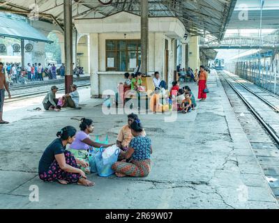 Passengers waiting for their trains at Yangon Central, the main railway station in Yangon, Myanmar. Stock Photo