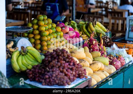 An array of fresh fruits on display at the local day market in Koh Lipe, Thailand Stock Photo