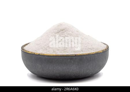 Natural minaret crystal non-iodized grinding salt isolated on white background. Ground rock salt in bowl Stock Photo
