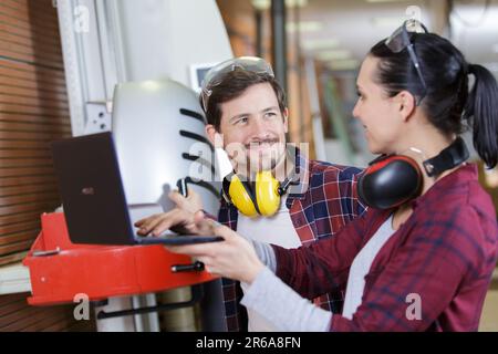 wood industry technicians working together on project Stock Photo