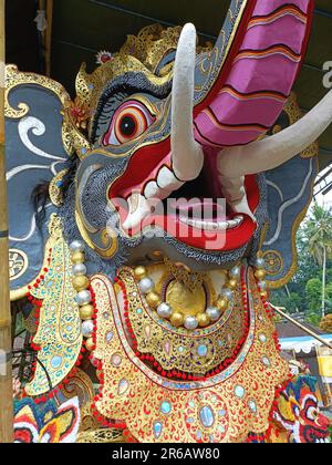 Closeup of a colorful elephant head sculpture made by Balinese artisans for a cremation ceremony. The gigantic figure will soon be consumed by fire. Stock Photo