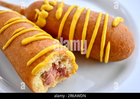 Corn dogs with mustard Stock Photo