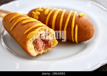 Corn dogs with mustard Stock Photo