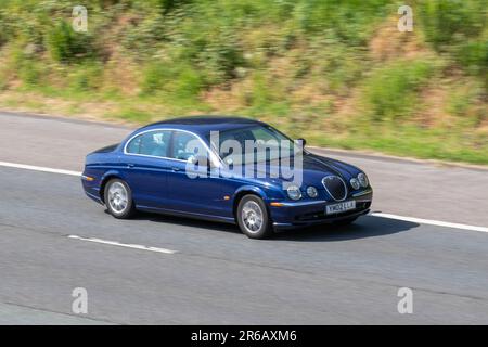 2002 Blue Jaguar S-Type V6,  Car Saloon Petrol 2496 cc; travelling at speed on the M6 motorway in Greater Manchester, UK Stock Photo