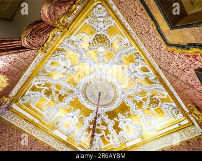 Rare Rococo white and gilt stucco decoration ceiling of the Queen's room  - Royal Palace of Naples that In 1734 became the royal residence of the Bourbons - Naples, Italy Stock Photo