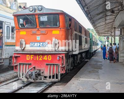 Passenger train with old diesel engine at Yangon Central, the main railway station in Yangon, Myanmar. This is the Circular Train, a local circular li Stock Photo