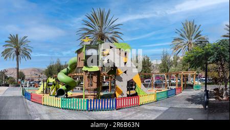 Public childrens playground in Pajara, Fuerteventura - large play tower with tunnel slide Stock Photo