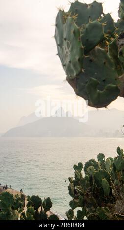 A scenic view of the Dois Irmaos peak, seen from the Arpoador beach in Rio de Janeiro, Brazil Stock Photo