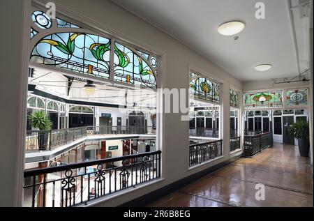 Art Nouveau coloured glass adorns the upper level gallery inside the Wayfarer's Arcade, off Lord Street, Southport. Stock Photo