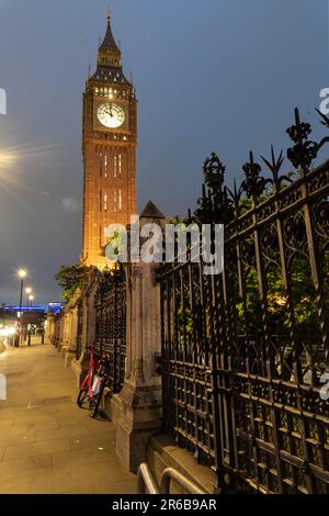 An iconic nighttime view of Big Ben in London, England, illuminated against a dark sky Stock Photo