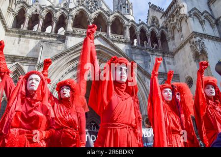 Extinction Rebellion protesters wearing red costumes, known as the Red ...