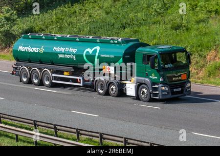 Morrisons green white supermarket petrol tanker, tanker truck, gas truck, fuel truck;  Haulage delivery trucks, lorry, transportation, truck, cargo carrier, MAN vehicle, European commercial transport, industry, M6 at Manchester, UK Stock Photo