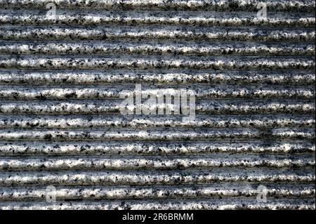 Horizontal stripes in granite. Dark gray striped background texture. Stock Photo