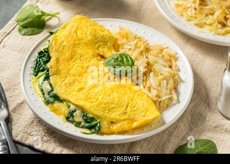 Homemade Spinach Florentine Omelet with Cheese and Potatoes Stock Photo