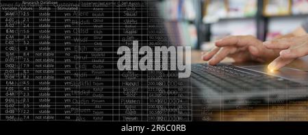Data entry concept. A man is entering information or updating records in a database or computer system, or spreadsheet. Stock Photo