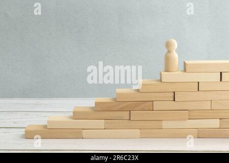 Wooden blocks in form of ladder upstairs red on dove background. Most important factors for career development concept Stock Photo