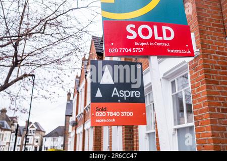 LONDON- MARCH, 2023: Estate Agent sold signs on residential street in south London Stock Photo