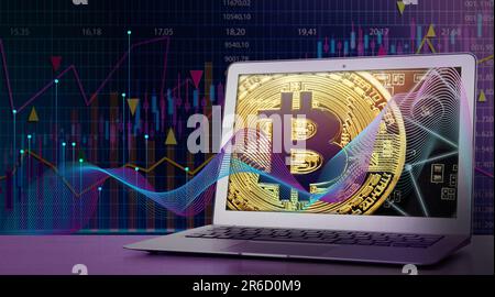 Digital currency security. Laptop with bitcoin on screen on table. Data, charts and graphs Stock Photo