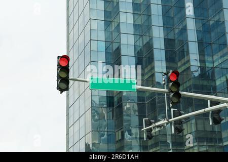 Overhead traffic lights in city. Road rules Stock Photo