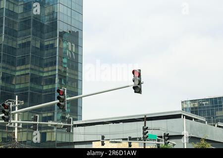 Overhead traffic lights in city. Road rules Stock Photo