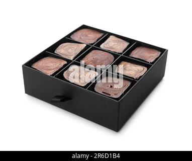 Box of delicious chocolate candies isolated on white Stock Photo