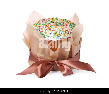 Traditional Easter cake with sprinkles wrapped in parchment paper with ribbon isolated on white Stock Photo