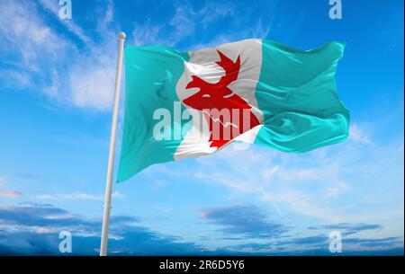 flag of Indo-Aryan ethnoreligious groups Koryaks at cloudy sky background, panoramic view. flag representing ethnic group or culture, regional authori Stock Photo
