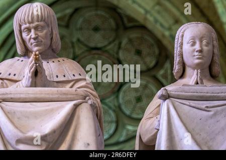 Close up of marble statue of rulers of France in an attitude of prayer on display in St. Denis Basilica Paris France. Fine details of hair, clothing Stock Photo