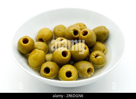 Pitted green olives in a bowl isolated on white Stock Photo