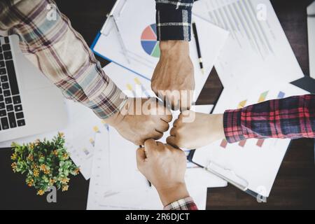 group of like-minded people cupping their palms together Stock Photo
